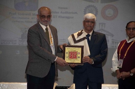 Prof. Indranil Manna felicitating the President, WAST